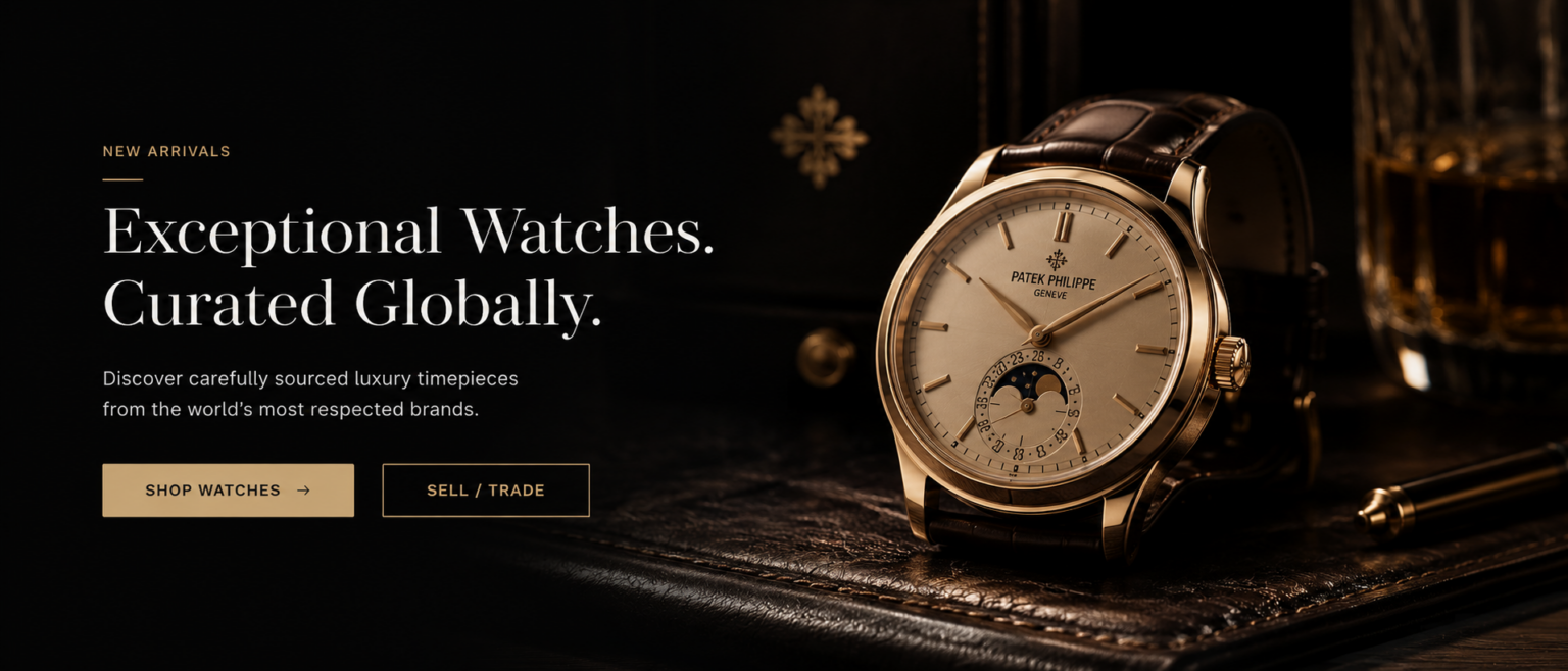 A gold watch photographed in a dark setting